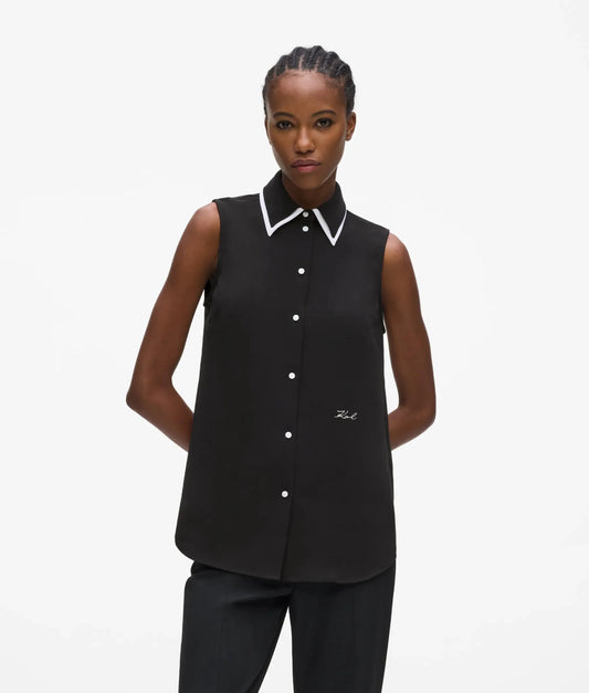 Black and white sleeveless blouse